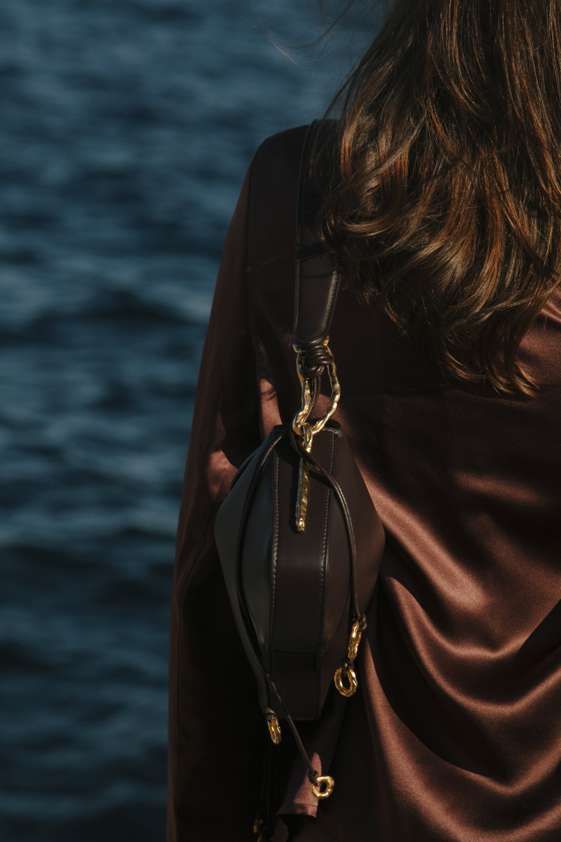  Deià handmade Nappa Leather Shoulder bag with Hanging Organic Rings senderkis dark chocolate side view Ceam